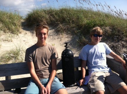 Ocracoke high school students Dalton Kalna and Kyle Tillett came out to help (and earn community service time as required by the school.) They carried back a scuba tank that had washed up. 